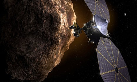 An artist’s impression of Nasa’s Lucy spacecraft flying past an asteroid in the orbit of Jupiter