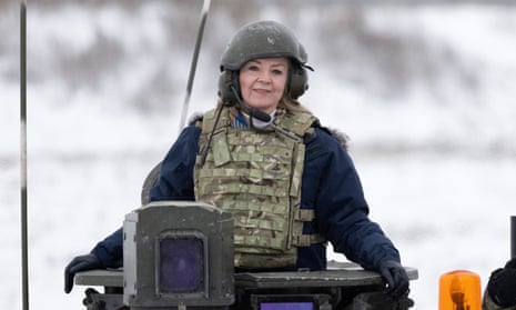Liz Truss poses in a tank as she visits British troops on deployment to Estonia