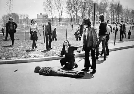 Black and white image of a young woman beside a dead student on the ground after the National Guard fired on a protest about President Nixon’s decision to invade Cambodia, 1970