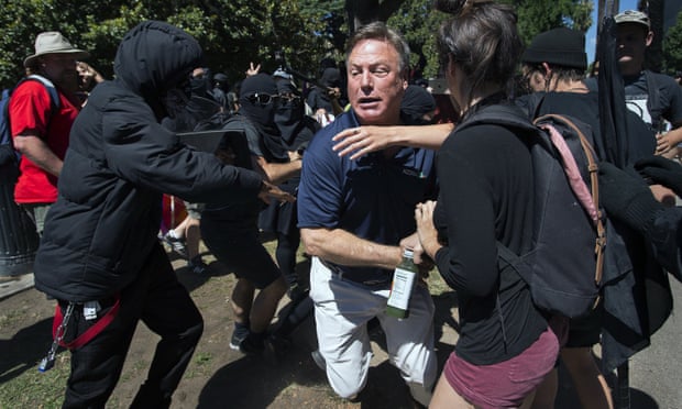 KCRA television reporter Mike Luery runs away from members of Antifa Sacramento, who staged a counter-protest against the Traditionalist Worker party and the Golden State Skinheads, in Sacramento, California on 26 June 2016.
