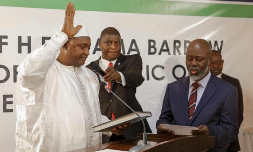 Adama Barrow, left, is sworn in as president of the Gambia.