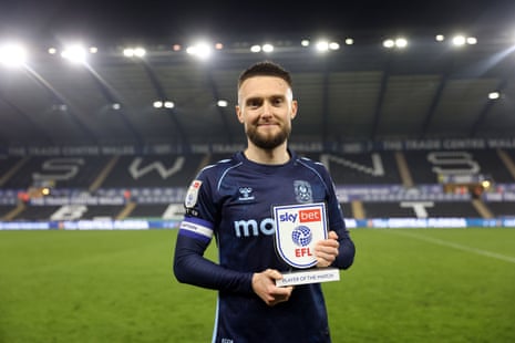 Matt Grimes with his player of the match award after Coventry's win at Swansea