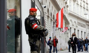 An armed member of the special forces stands guard near the site of the gun attack in Vienna