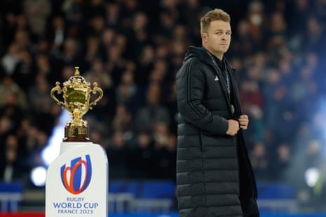 New Zealand's Sam Cane looks dejected as he walks past the trophy.