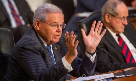 Bob Menendez speaks during a Senate foreign relations committee hearing, flanked by James Risch, in August 2021.
