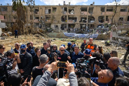 Netanyahu speaking to the media on Sunday while visiting an area destroyed by an Iranian ballistic missile in Dimona.