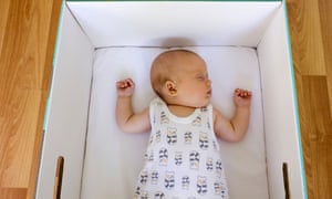 Baby sleeping in maternity box