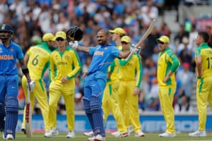 Dhawan celebrates his century.