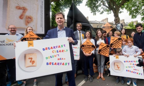 Nick Clegg at the launch in central London of a Lib Dem campaign poster attacking the Conservatives’ school meals policy.