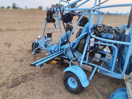 A blue coloured junta paramotor trike