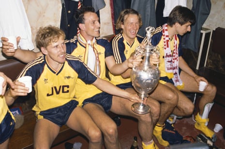 Kevin Richardson, Steve Bould, Paul Merson and Alan Smith celebrate with the First Division trophy after Arsenal beat Liverpool 2-0 in May 1989 after late drama.