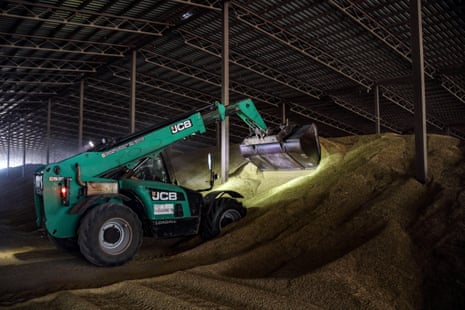 A bucket loader piles up grain at a warehouse in Odesa Region, southern Ukraine.