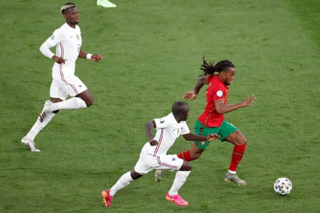 Portugal’s Renato Sanches (right) is chased by France’s N’Golo Kante.