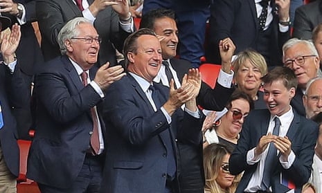 David Cameron celebrates Aston Villa’s opening goal in the championship playoff with his son.