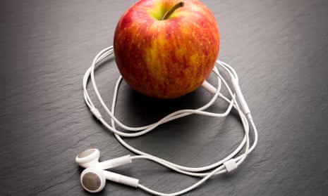 An apple with iPod earphones