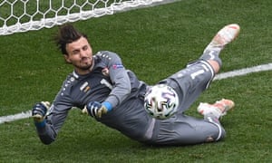 North Macedonia’s keeper Stole Dimitrievski saves a penalty taken by Ukraine’s Ruslan Malinovskyi.