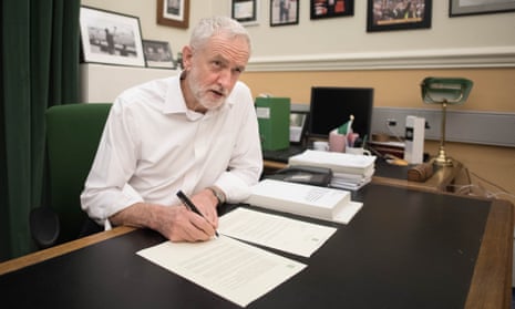 Jeremy Corbyn signs a letter he has written to Theresa May laying out Labour’s five Brexit demands.