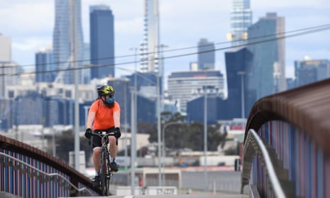 A cyclist crosses an overpass in Melbourne, Australia, 12 August 2020.