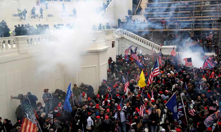 Police release teargas into a crowd of pro-Trump rioters on 6 January at the US Capitol.