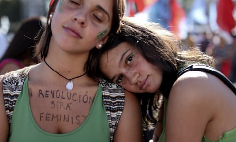A woman protests with the message ‘The revolution is feminist’, in Buenos Aires.