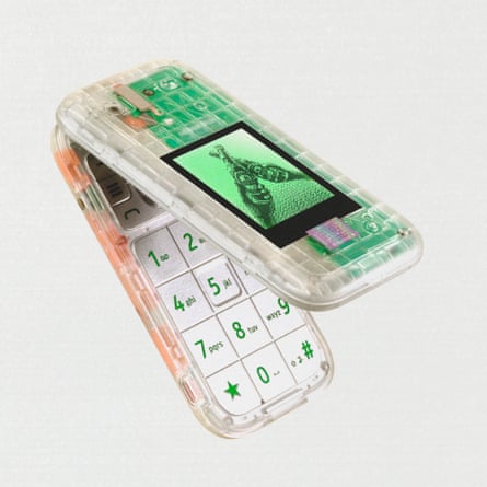 Product shot of an old fashioned flip-open mobile phone with a transparent case and a basic mono screen on the shell