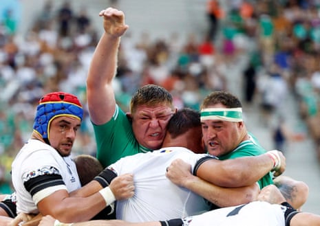 Ireland's Tadhg Furlong is squished during a ruck against Romania.
