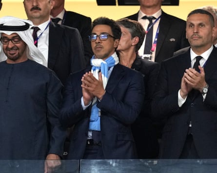 The Manchester City owner, Sheikh Mansour (centre), and chair, Khaldoon al-Mubarak (right), applaud from the directorsâ box.