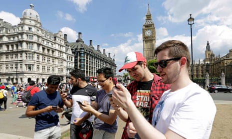 A group of men search for Pokémon Go characters in Westminster, London.