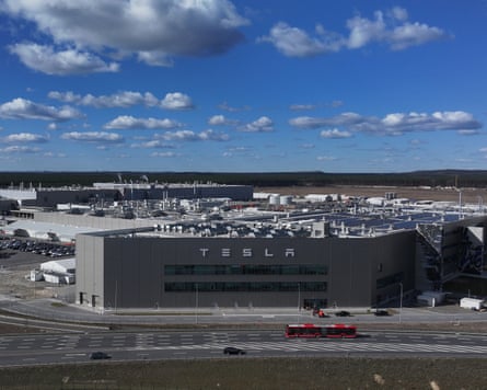 The Tesla Gigafactory with forests in the background.