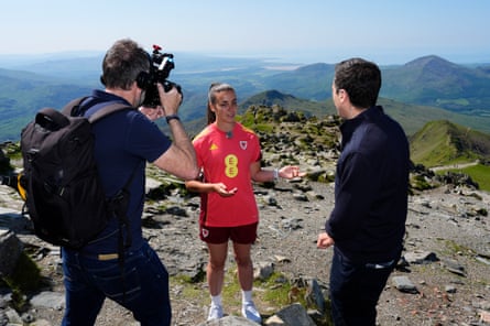 Wales’s Olivia Clark is interviewed at the summit of Yr Wyddfa.