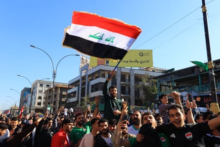 Fans fly Iraq flags on the streets of Baghdad