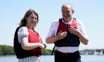 Lib Dem leader Sir Ed Davey and Lib Dem parliamentary candidate Jess Brown-Fuller at Birdham Pool Marina, Chichester. Both are wearing life jackets.