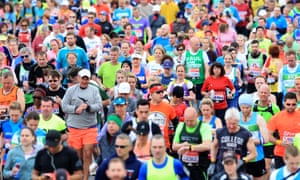 Runners make their way over the start line during the 2016 London marathon.