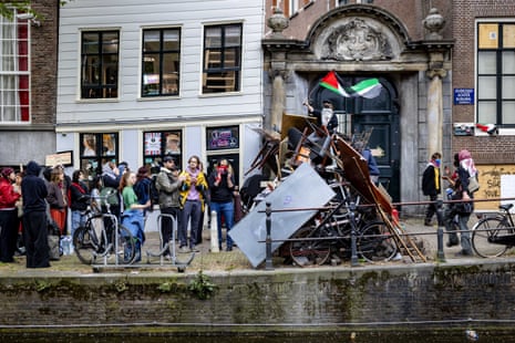 Demonstrators next to one of the barricades at the Binnengasthuis site of the University of Amsterdam in the Netherlands.
