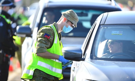 ADF personnel works at vehicle checkpoint on Princes Freeway outside Melbourne