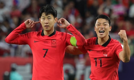 South Korea players celebrate a goal against Australia at Al Janoub Stadium.