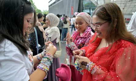 Taylor Swift fans exhanging friendship bracelets in Singapore, 2 March 2024.