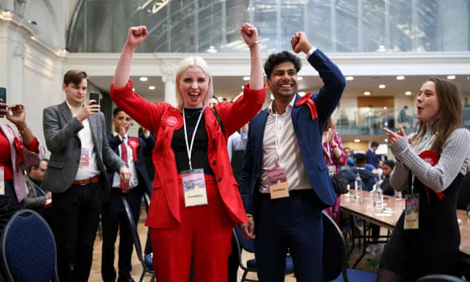 Labour party candidates and supporters celebrate