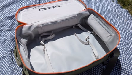 inside of cooler on blanket in grass