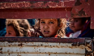 Syrian Arab and Kurdish civilians arrive to Tall Tamr town, in the Syrian northwestern Hasakeh province, after fleeing Turkish bombardment.