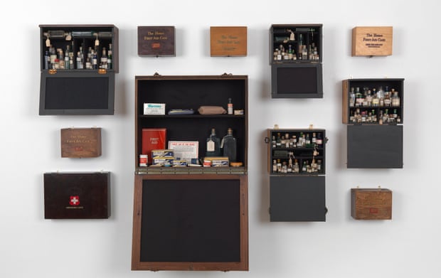 Emergency case: Homage to Joseph Beuys, 1969-2012 (13 wooden felt-lined first aid cabinets, containing bottles of holy water and vintage first aid supplies), by Susan Hiller
