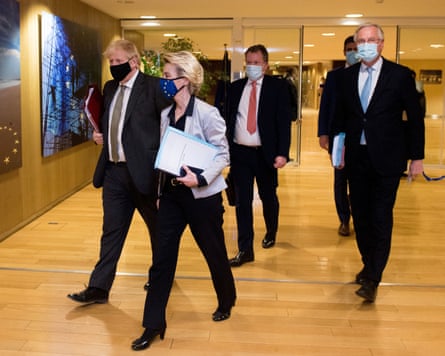 Boris Johnson, Ursula von der Leyen, David Frost and Michel Barnier walk through the lobby of a building, wearing Covid-era face masks