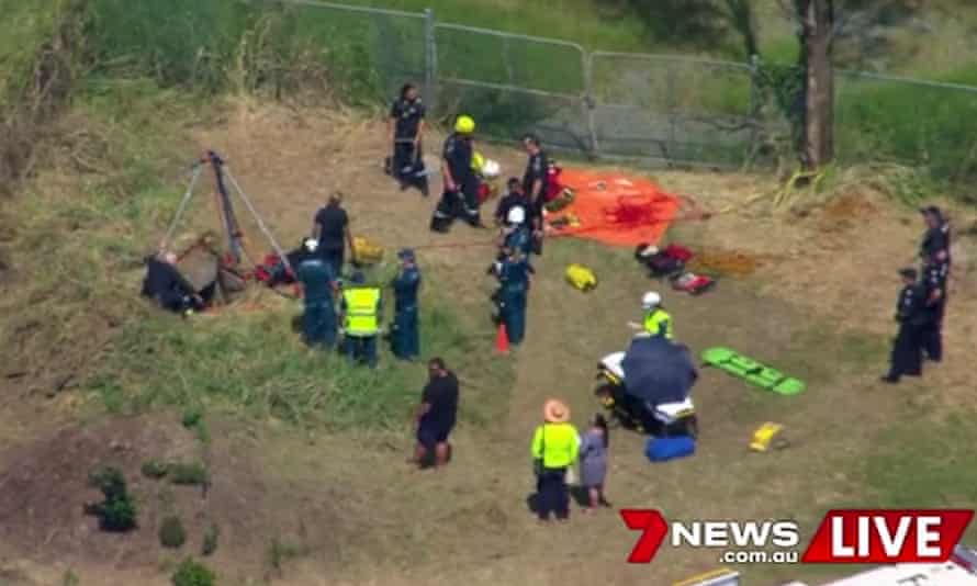 Rescue crews pulled a young Brisbane man from the bottom of an eight-metre drain