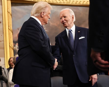 Donald Trump greets Joe Biden as he arrives for inauguration ceremonies in the Rotunda of the US Capitol on 20 January 2025.