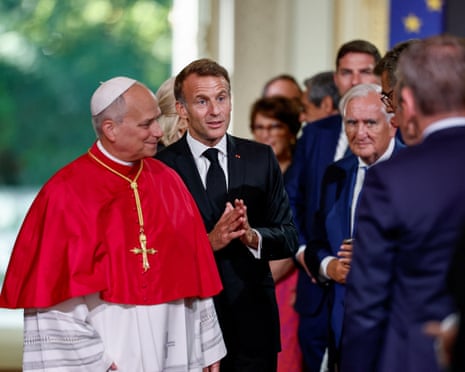 French president Emmanuel Macron and Pope Leo react during a meeting with authorities, members of civil society and the diplomatic corps at the Élysée Palace in Paris.