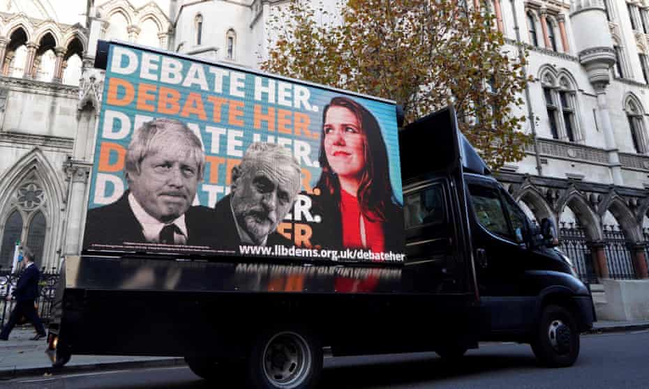 A Liberal Democrat advertising van drives past the high court in London