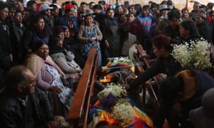 Mourners with the bodies of those killed in clashes between Evo Morales supporters and security forces in El Alto this week.