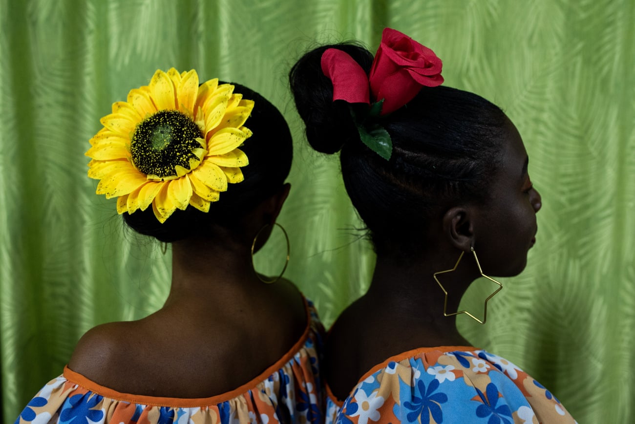 Two members of ‘Ecos del Tambor’ (Echoes of the drum), from the municipality of Robles, pose for a portrait.