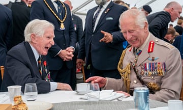 King Charles III speaks to a D-Day veteran Peter Newton