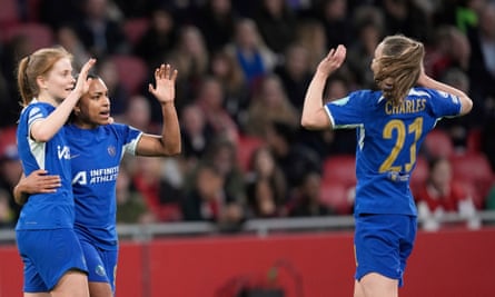Sjoeke Nüsken (left) celebrates with Catarina Macario (middle) and Niamh Charles (right) after scoring her side’s third goal during the first leg of the 2023-24 Women’s Champions League quarter-final match between Ajax and Chelsea at the Johan Cruyff Arena in Amsterdam on 19 March 2024